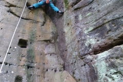 Alex bridging up Central Crack. The square pot holes once supported a building.